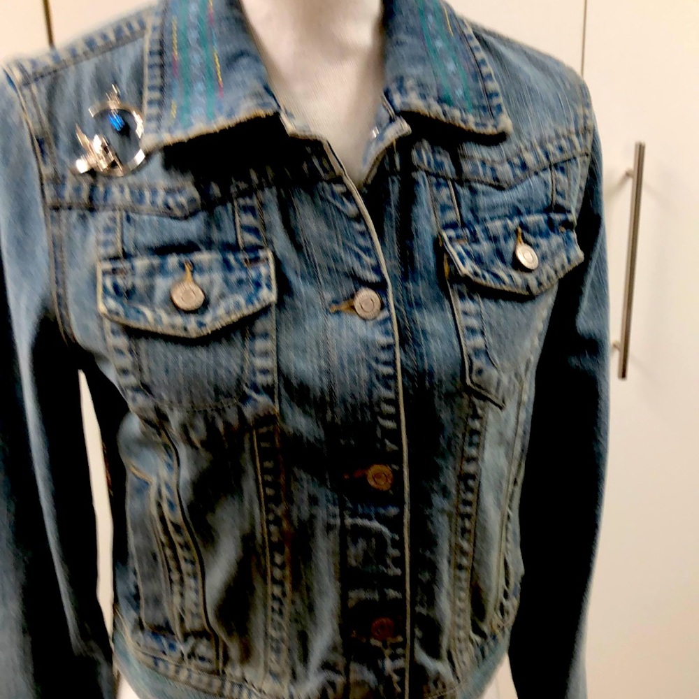 A custom embroidered jacket measures 15” across the back and is one of a kind.